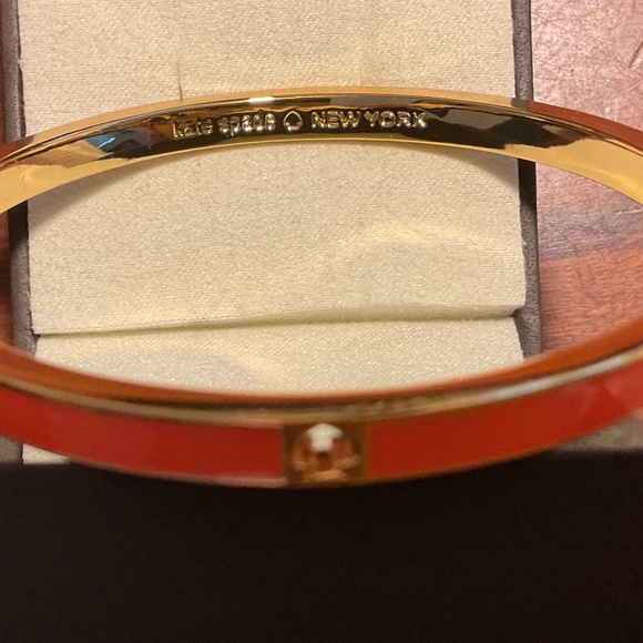 Vintage Kate Spade New York Orange Bangle Bracelet with the cut out “Spade”. - Picture 2 of 4